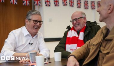 Prime Minister Sir Keir Starmer smiles during a meeting with locals at a community centre in Hertfordshire.