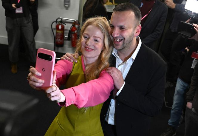 Green Party candidate Hannah Spencer poses for a selfie with Green Party leader Zack Polanski after winning the Gorton and Denton Parliamentary by-election in Manchester, northern England on February 27, 2026.