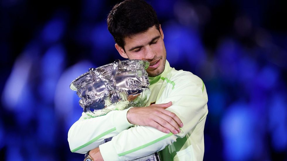 Carlos Alcaraz has become the youngest male player in tennis history to achieve the career Grand Slam, with the world No 1 beating Novak Djokovic in four sets to win the Australian Open title on Sunday