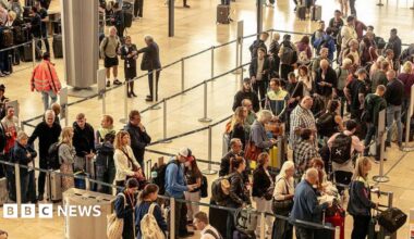 A crowd queues at a European airport