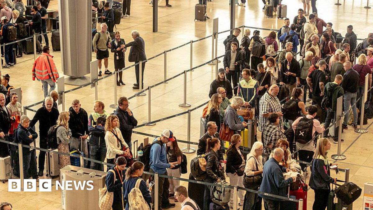 A crowd queues at a European airport