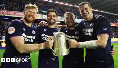 France's Antoine Dupont lifts the 2025 Six Nations trophy surrounded by team-mates
