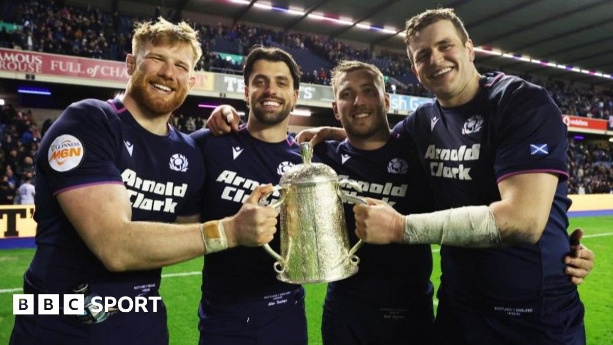France's Antoine Dupont lifts the 2025 Six Nations trophy surrounded by team-mates
