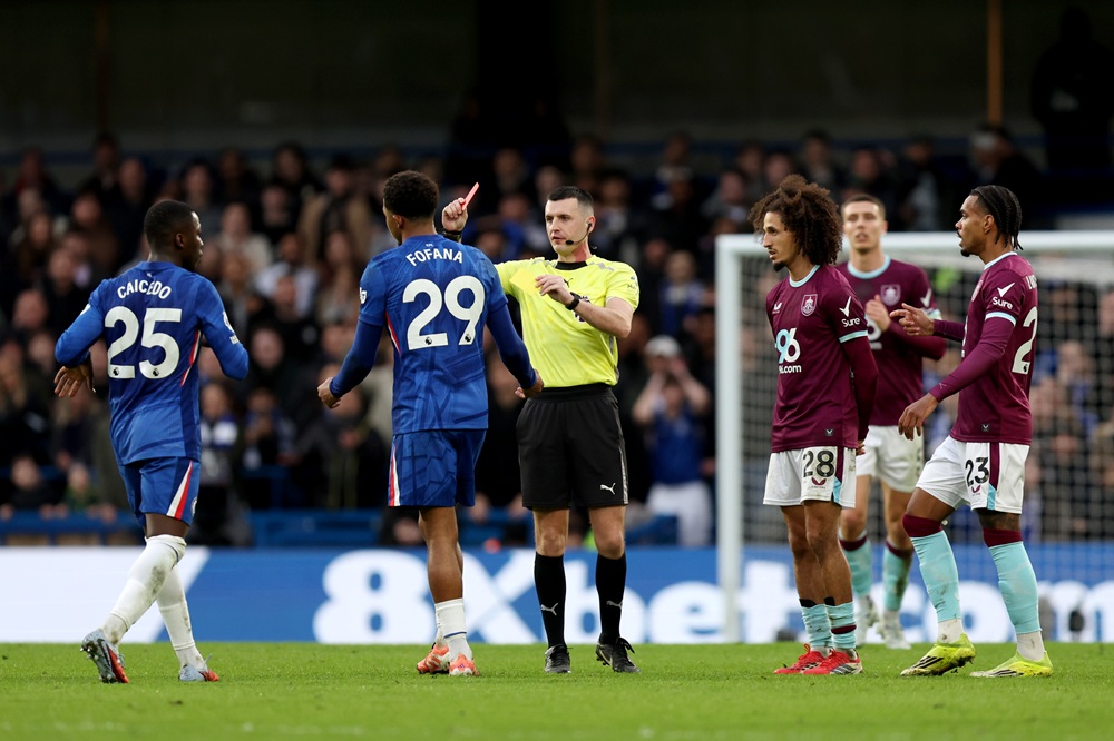 Wesley Fofana of Chelsea is shown a red card by match referee Lewis Smith during the Premier League match between Chelsea and Burnley at Stamford Bridge on February 21, 2026 in London, England. (Photo by Jasper Wax/Getty Images)
