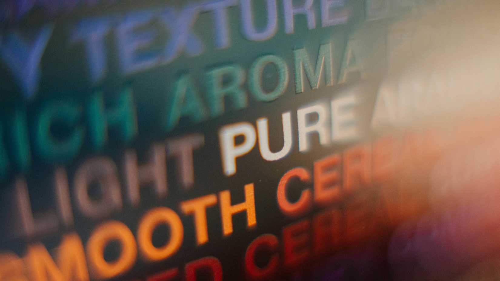 A blurry photo of several colorful text samples