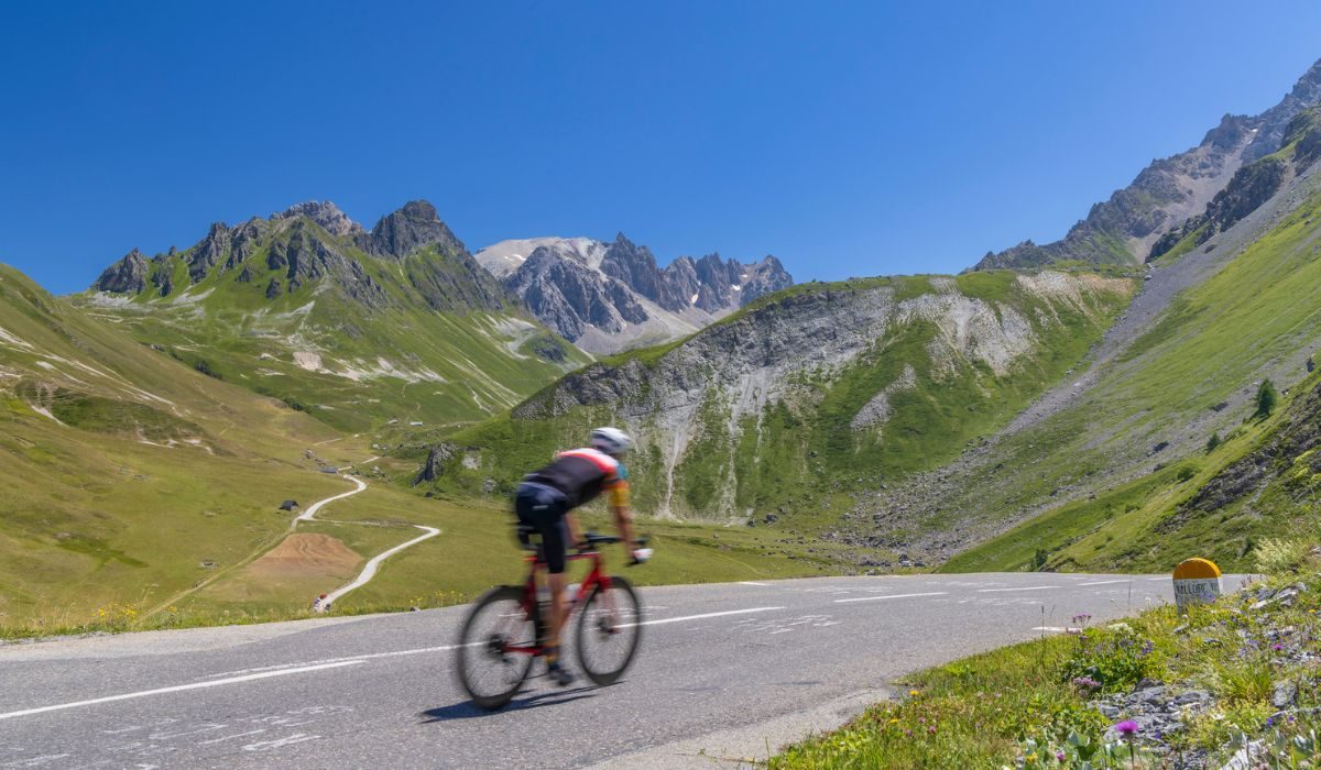 Cyclist on route des Grandes Alpes near Col du Galibier, Hautes-Alpes, France
