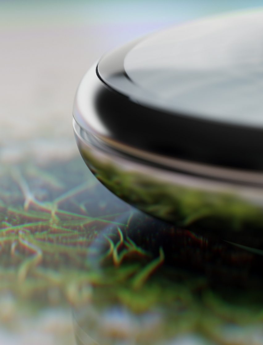 Close-up image of a detail of the Cognitive Bloom device, showing a smooth chrome bezel around the circular edge