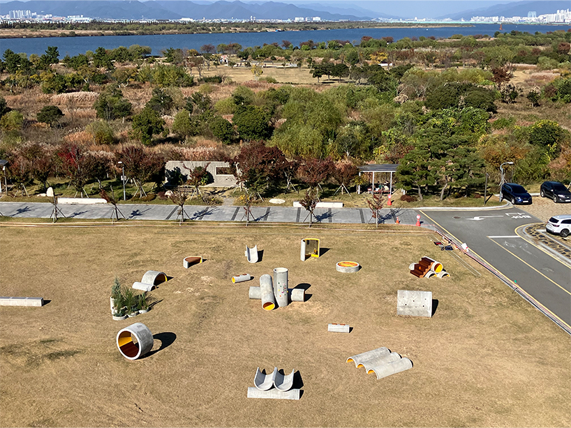 concrete utopia transforms discarded construction pipes into playground in south korea