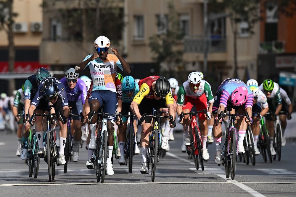 ROQUETAS DE MAR, SPAIN - FEBRUARY 15: (L-R) Matteo Moschetti of Italy and Team Pinarello Q36.5 Pro Cycling, Biniam Girmay of Eritrea and Team NSN Cycling, Milan Fretin of Belgium and Team Cofidis and Dylan Groenewegen of Netherlands and Team Unibet Rose Rockets sprint at finish line during the 39th Clasica de Almeria 2026 a 189.7km one day race from Puebla de Vicar to Roquetas de Mar on February 15, 2026 in Roquetas de Mar, Spain. (Photo by Dario Belingheri/Getty Images)