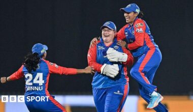 Delhi Capitals' Lizelle Lee celebrates with teammates after taking the wicket of Gujarat Giants' Sophie Devine