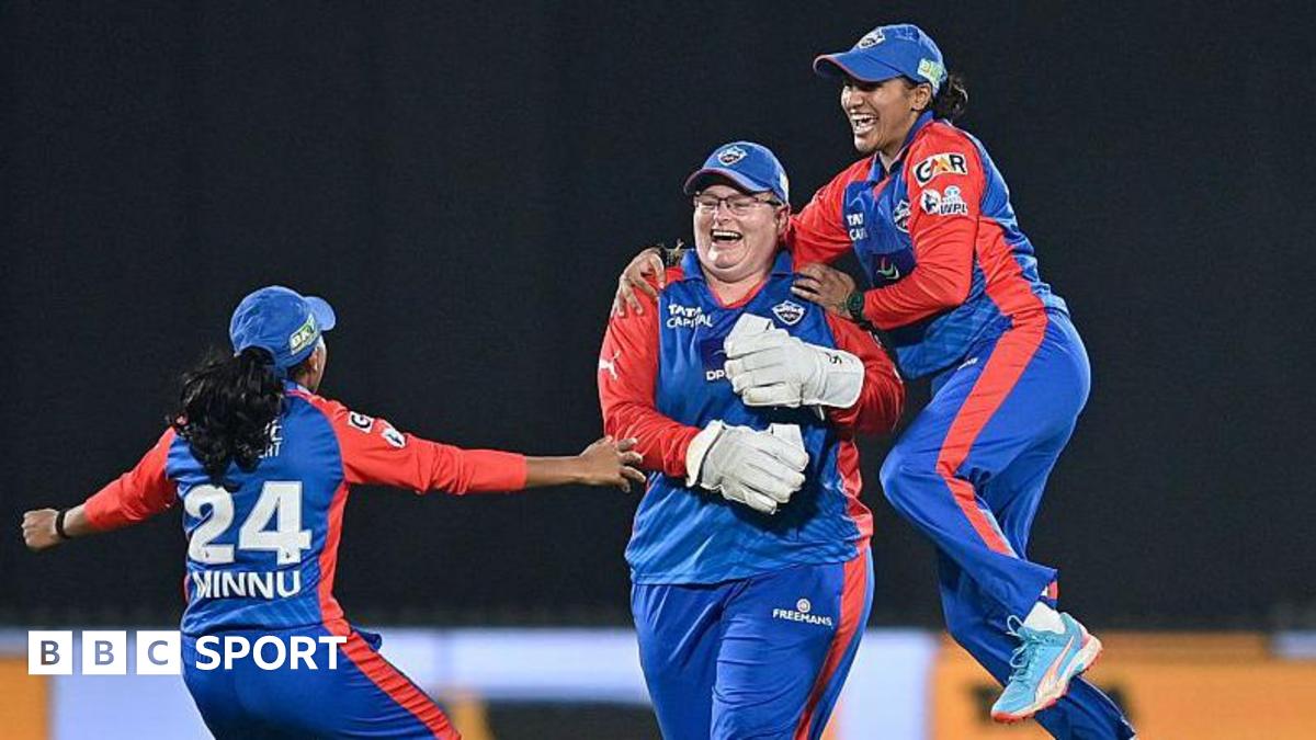 Delhi Capitals' Lizelle Lee celebrates with teammates after taking the wicket of Gujarat Giants' Sophie Devine