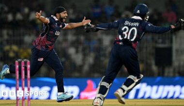 USA's Harmeet Singh spreads his arms out in celebration of taking his seventh wicket of the 2026 T20 World Cup
