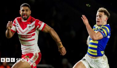 Cai Taylor-Wray (right) races in for his try for Warrington against St Helens