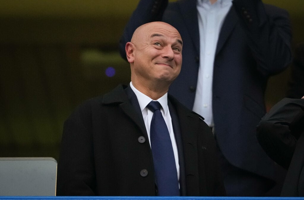 Daniel Levy smirks while watching Tottenham