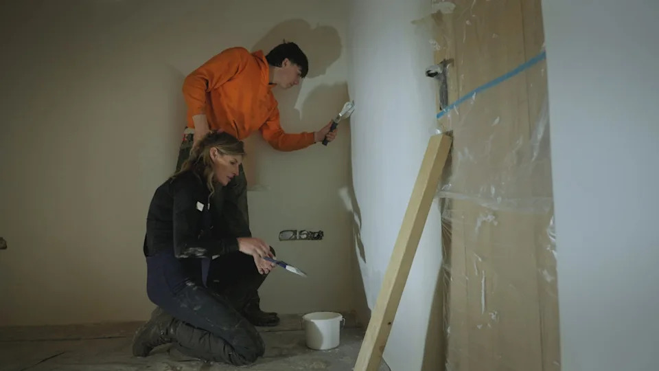 Amanda Owen and son Miles painting a room at Anty John's.