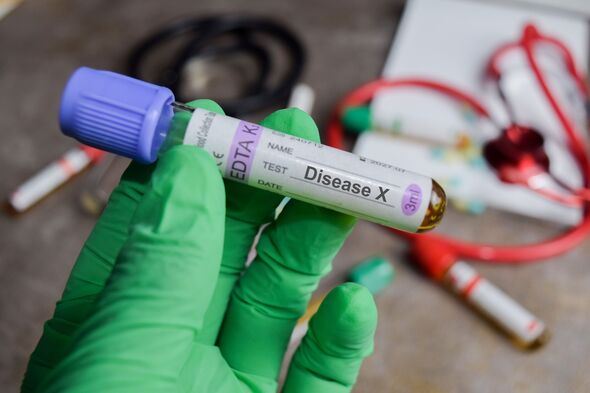 Disease X vaccination drug in green gloved hands. Medical concept