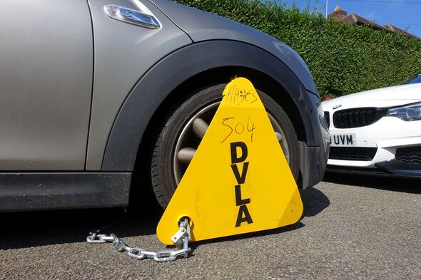 DVLA wheel clamp on untaxed BMW Mini vehicle