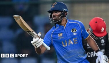 UAE's Aryansh Sharma blows a kissing while holding out his bat to celebrate making fifty against Canada