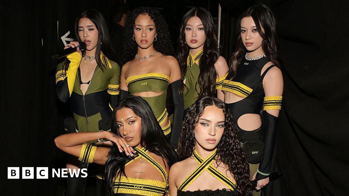 Six-member girl group Katseye in black, yellow and green outfits at the Grammy Awards.