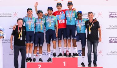 XDS-Astana Team's Italian rider Christian Scaroni (4R) celebrates with teammates on the podium after winning the 5th and last stage, and being winner overall of the Tour of Oman cycling race from Nizwa to Green Mountain, on February 11, 2026. (Photo by Loic VENANCE / AFP via Getty Images)