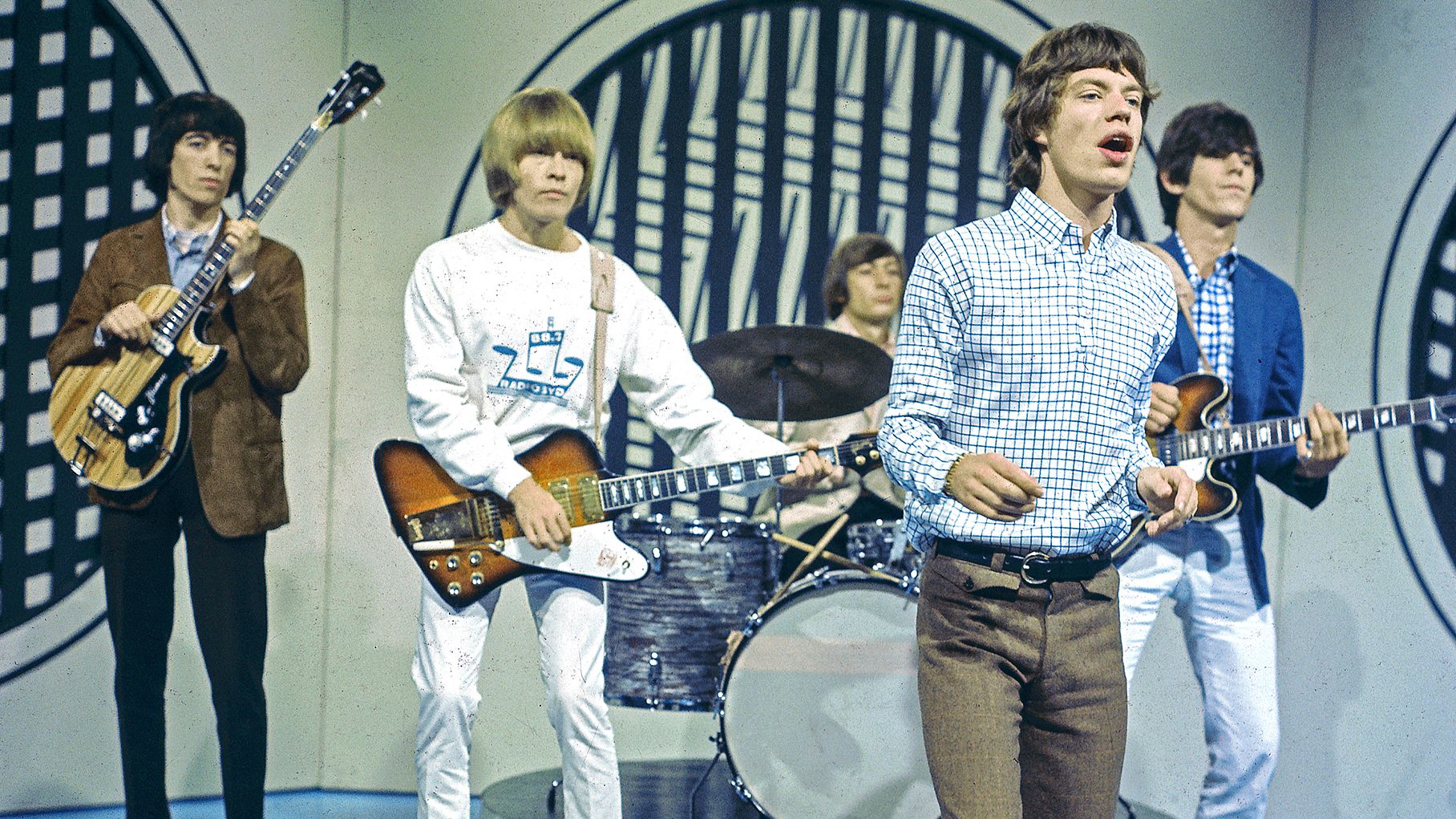 English rock group The Rolling Stones perform on the set of the ABC Television pop music television show Thank Your Lucky Stars at Alpha Television Studios in Birmingham, England on 30th January 1965. The band would play three songs on the show, Down Home Girl, Under the Boardwalk and Susie Q. Members of the group are, from left, Bill Wyman, Brian Jones (playing Gibson Firebird guitar), Charlie Watts, Mick Jagger and Keith Richards (playing Epiphone guitar).