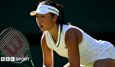 Mimi Xu prepares to receive a serve at Wimbledon