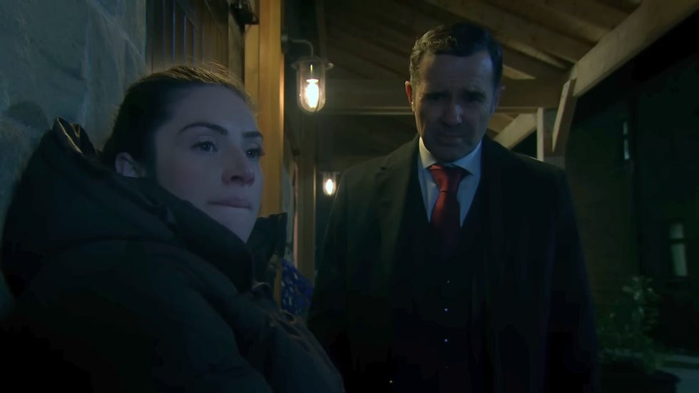 emmerdale, victoria and graham outside the stables at night time