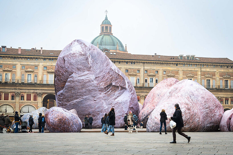 ENESS installs luminous inflatable boulders in bologna's historic piazza maggiore