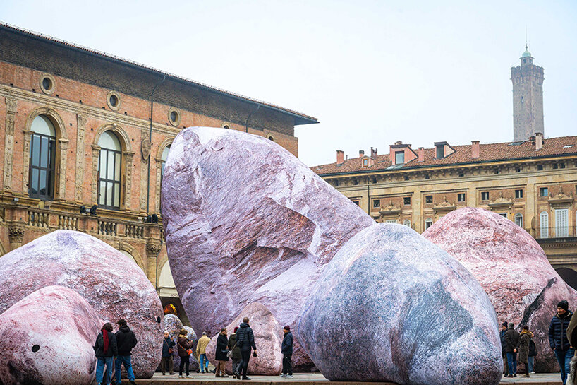 ENESS installs luminous inflatable boulders in bologna's historic piazza maggiore