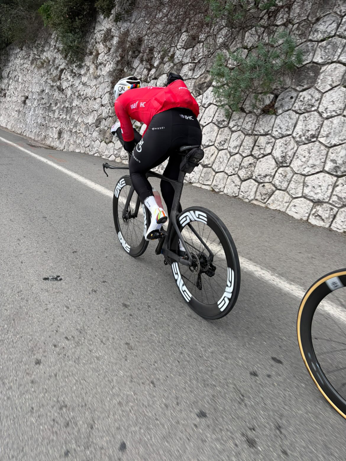 Tadej Pogačar riding a unmarked time trial bike