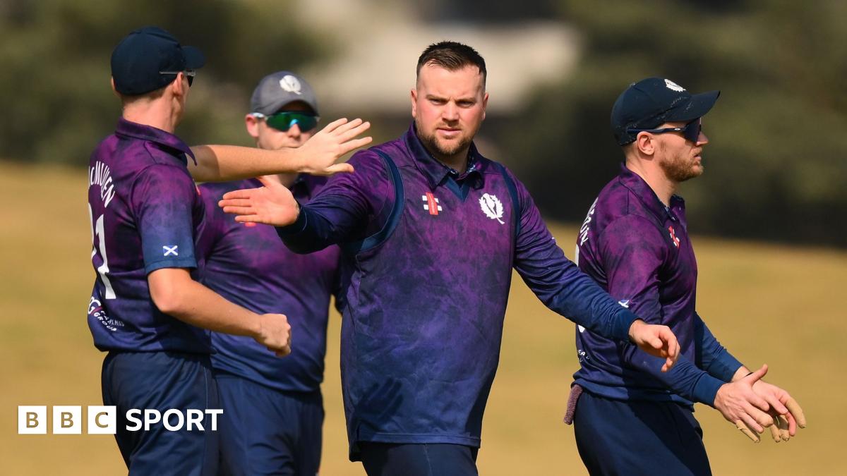 Mark Watt celebrates taking a wicket against Afghanistan in a T20 World Cup warm-up match