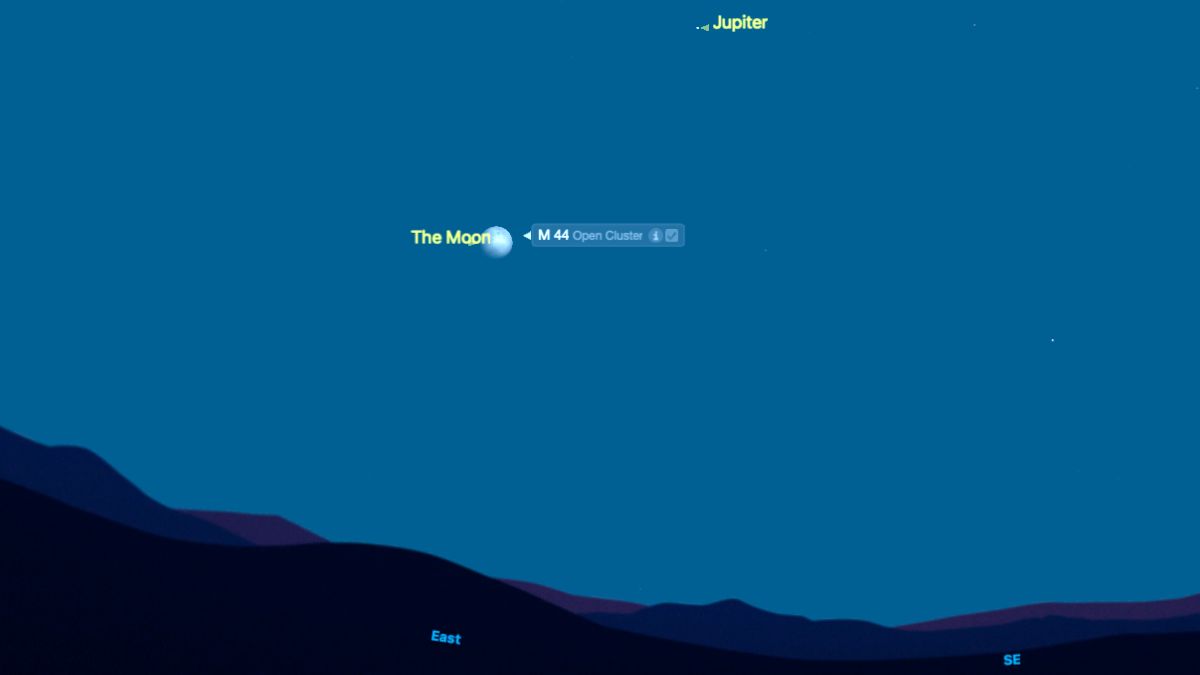 A pale blue night sky shows yellowed labeled dots of Jupiter and the moon