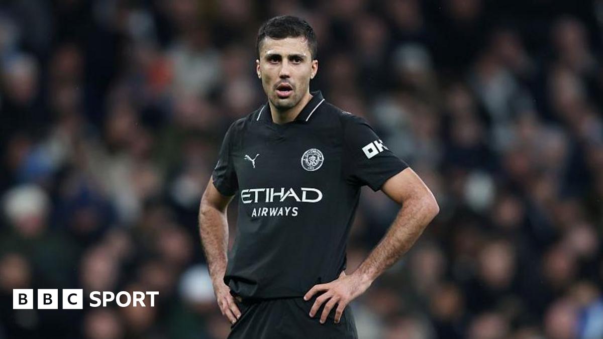 Rodri stands with his hands on his hips during Manchester City's game at Tottenham