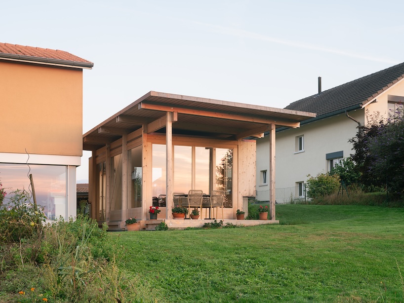 timber garden folly pavilion transitions between resting shelter and planted patio
