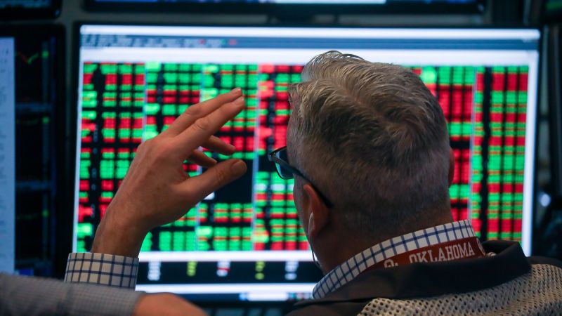 Dow tumbles more than 800 points as tariff uncertainty and AI disruption fears roil markets