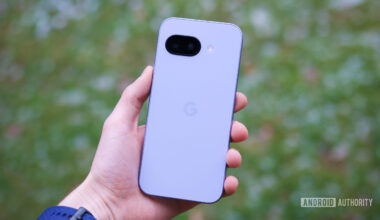 Someone holding the Pixel 9a, showing the back of the phone.