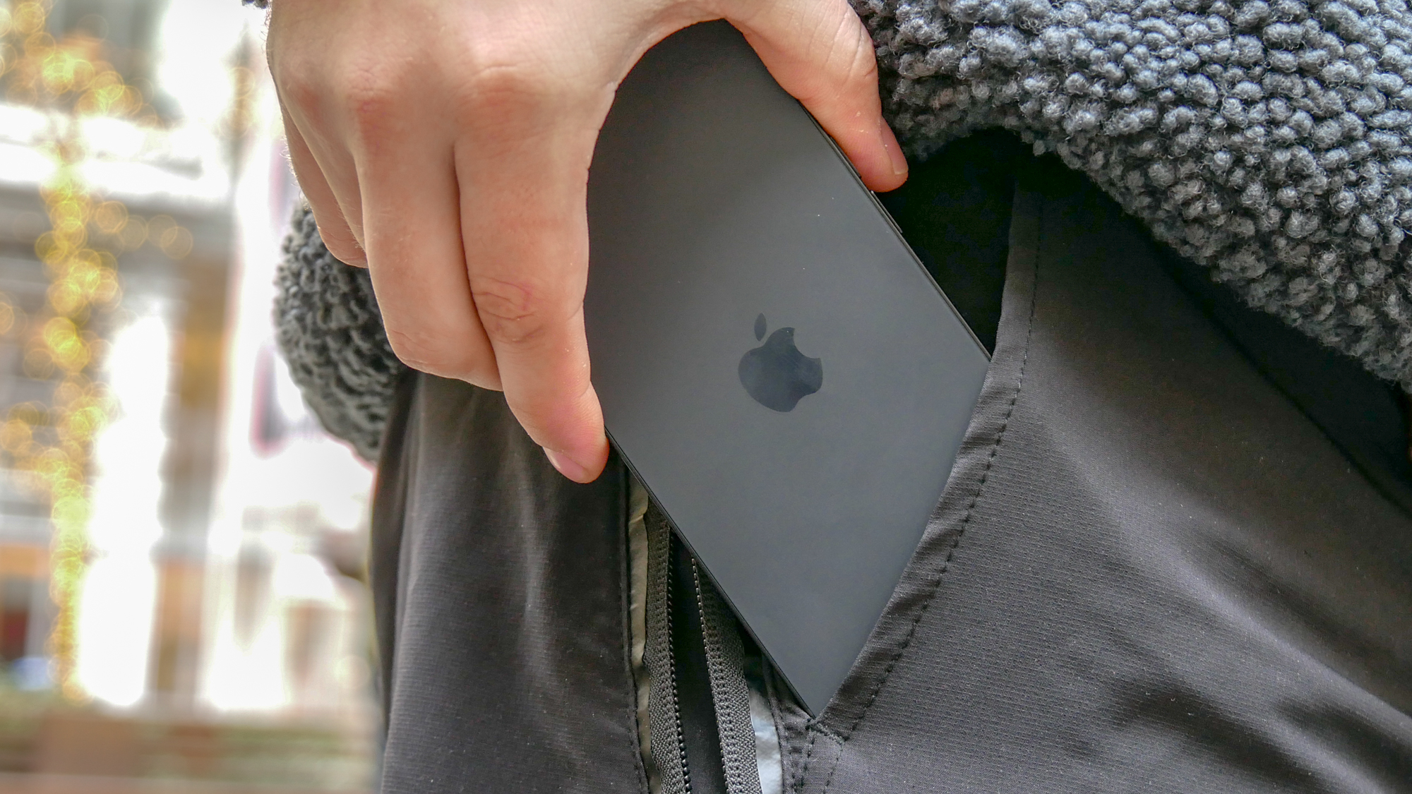 iPhone 16e in a pocket.