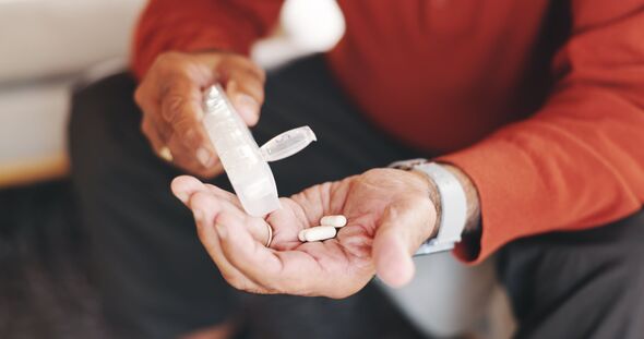 Hands, pills and capsule for arthritis, pain and illness or chronic disease treatment. Elderly, senior person and pharma with drugs for retirement, we