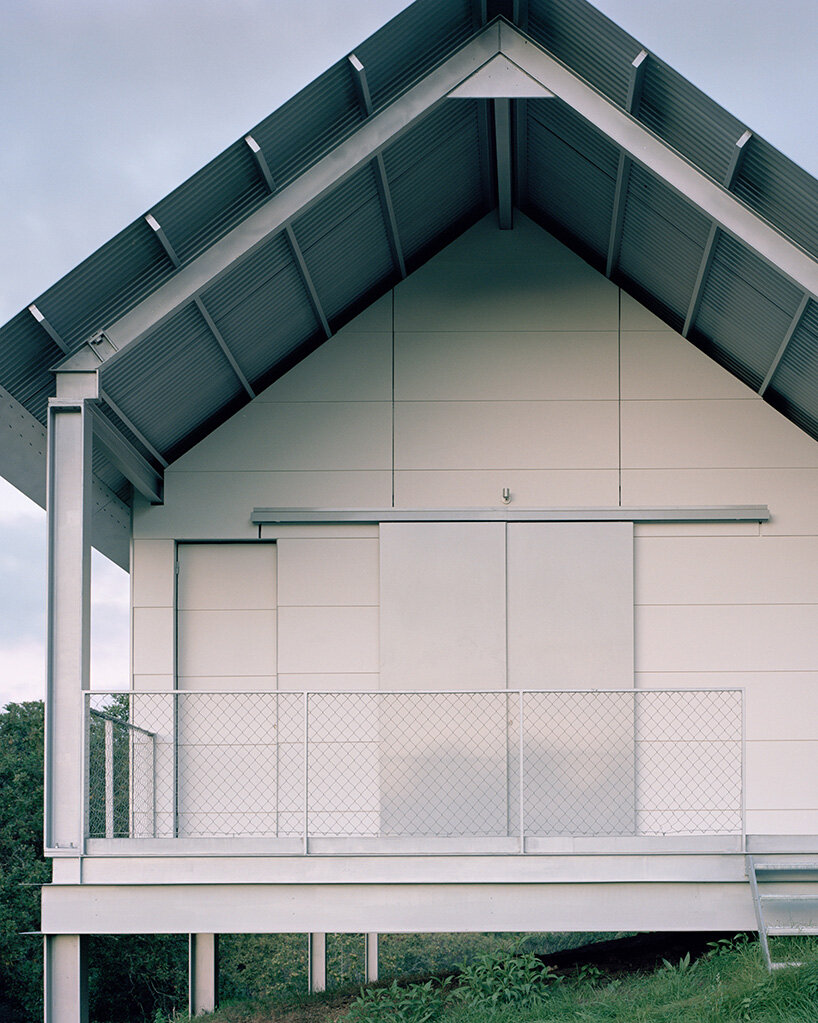 HANGHAR assembles steel-framed prefab residence in 48 hours on sloped spanish plot