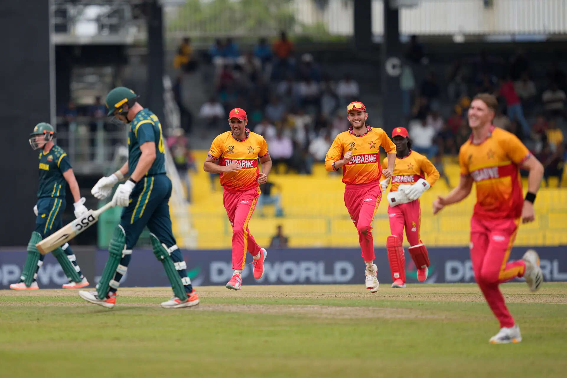 Zimbabwe's players celebrates the wicket of Australia's Ben Dwarshuis during the T20 World Cup cricket match. (AP/PTI) ICC T20 WC 2026: AUS vs ZIM