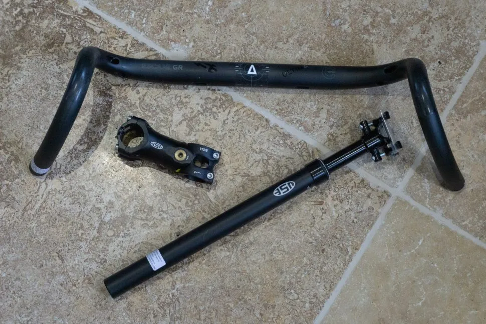 Black bicycle handlebars, stem and seatpost