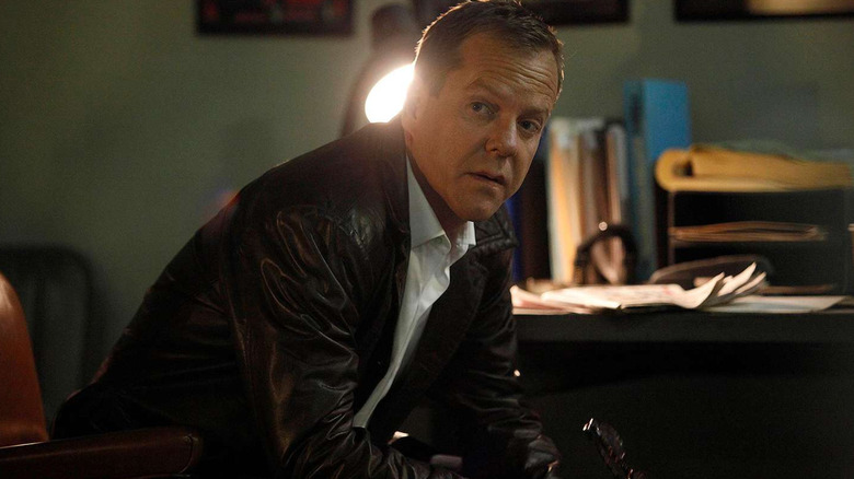 A sitting Jack Bauer turns his head