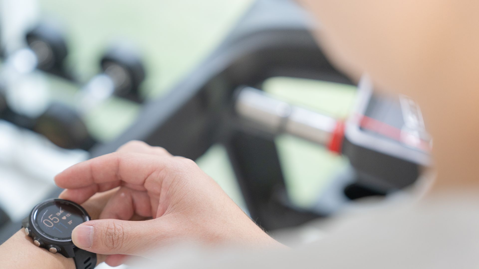 Woman checking her heart rate on her fitness tracker