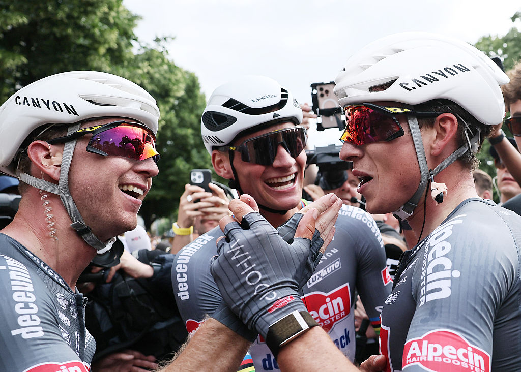 LILLE, FRANCE - JULY 05: (L-R) Kaden Groves of Australia, Mathieu van der Poel of Netherlands and stage winner Jasper Philipsen of Belgium and Team Alpecin - Deceuninck react after the 112th Tour de France 2025, Stage 1 a 184.9km stage from Lille to Lille / #UCIWT / on July 05, 2025 in Lille, France. (Photo by Christophe Petit Tesson - Pool/Getty Images)