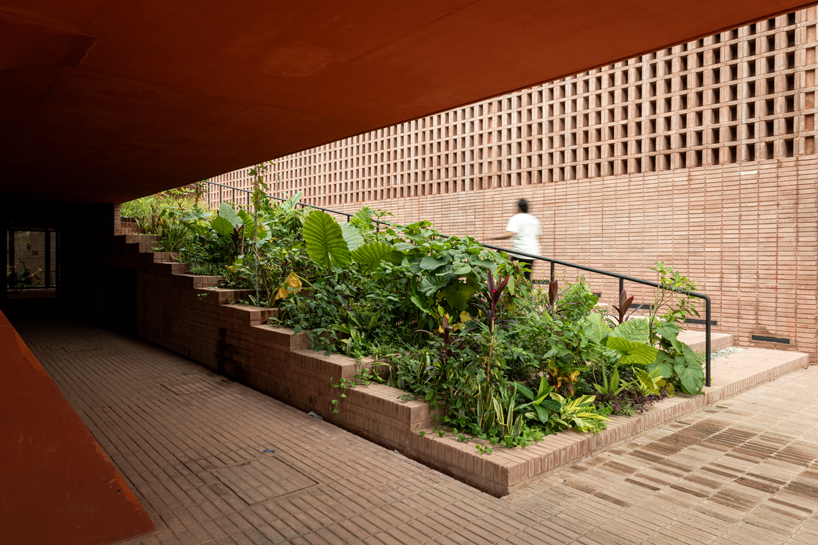 cast in red-pigmented concrete, la cacaotera museum celebrates cacao heritage in mexico - 4