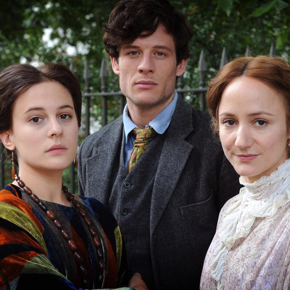 group portrait of three individuals in period clothing