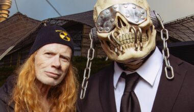 Megadeth singer/guitarist Dave Mustaine standing next to the band's skeleton mascot Vic Rattlehead