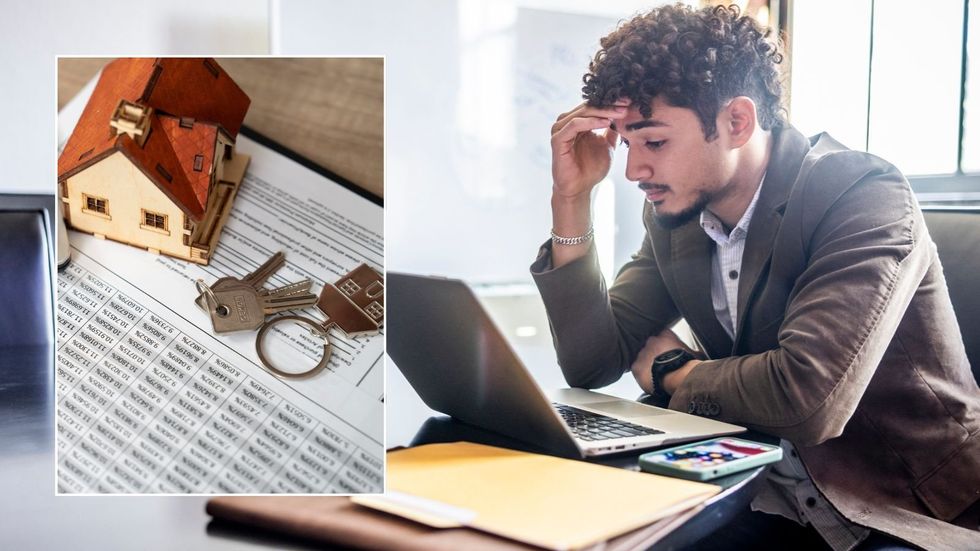 Man on computer and mortgage deal