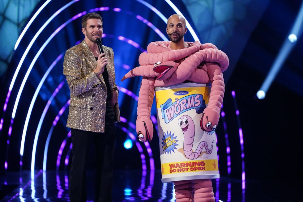masked singer uk season 7 joel dommett marvin humes can of worms two performers on stage during a show