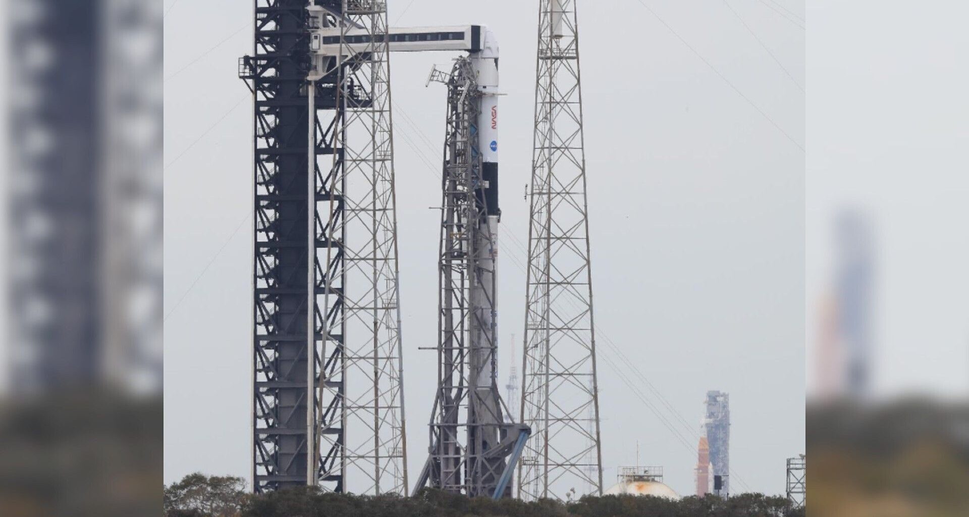 Artemis 2 rocket photobombs SpaceX Crew-12 photo of the day for Feb. 13, 2026